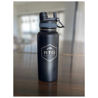 RTG 32oz Water Bottle Sitting on Piano