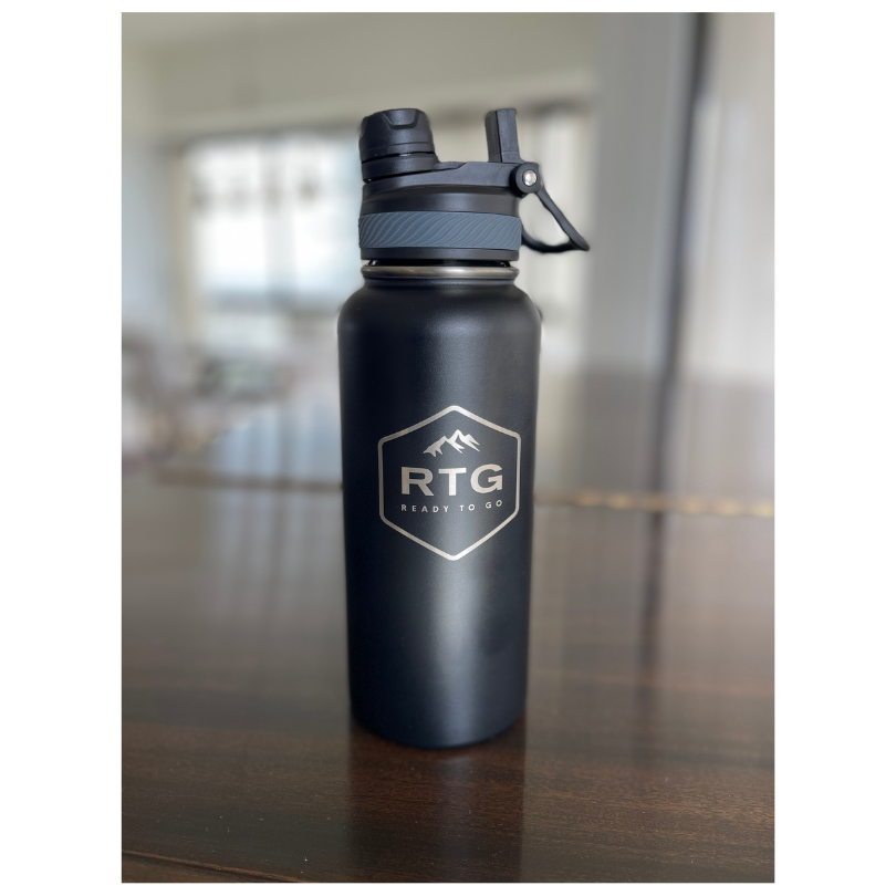 RTG 32oz Water Bottle Sitting on Piano